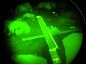 Fig. 4: Illuminated runway from the air seen through image intensifier goggles. (Comment: Photo taken at the Night Vision Training System of the Königsbrück Aviation Physiology Training Center)